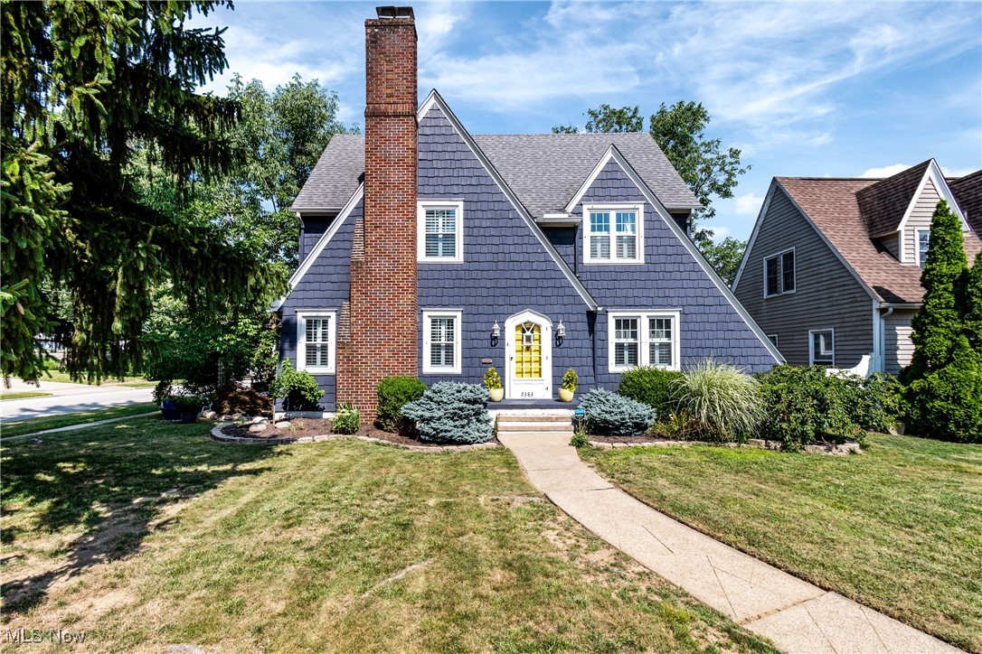 This beautifully crafted residence offers the perfect blend of timeless character and modern convenience. With 4 bedrooms, 2.5 baths, and over 3,000 square feet of thoughtfully designed living space, the home delivers warmth, charm, and custom finishes at every turn. From its inviting exterior to the designer-inspired interior, each space feels completely custom. The light-filled living room is anchored by a stunning original stone fireplace, while the formal dining room provides an elegant space for hosting. The kitchen is both functional and stylish, featuring a large island with bar-height seating, newer appliances, and original leaded glass cabinetry. A dedicated first-floor office offers a built-in hideaway desk, a charming window seat, and French doors that open to the patio—creating an inspiring space to work or relax. Throughout the home, built-ins, chair rails, and beautifully finished hardwood floors highlight the attention to detail and craftsmanship. Upstairs, the spacious second-floor bath boasts dual sinks and a luxurious soaking tub. All four bedrooms include walk-in closets. The finished lower level provides a generous rec room, a sleek full bathroom with a tile shower, and extensive storage. Both the basement and garage feature Nature Stone flooring, and the basement has been professionally waterproofed with a transferable warranty for added peace of mind. Outdoors, enjoy a partially fenced backyard complete with a covered patio, open lawn space, and a delightful wood playhouse. A screened-in porch and recent updates—including a new garage door, sunroom pocket doors, kitchen window, washer and dryer, central air, and furnace, all completed in 2024—ensure this home is as practical as it is beautiful. Set in a desirable neighborhood close to parks, shops, and dining, this property is a rare opportunity to own a spacious, character-rich home that has been thoughtfully updated.