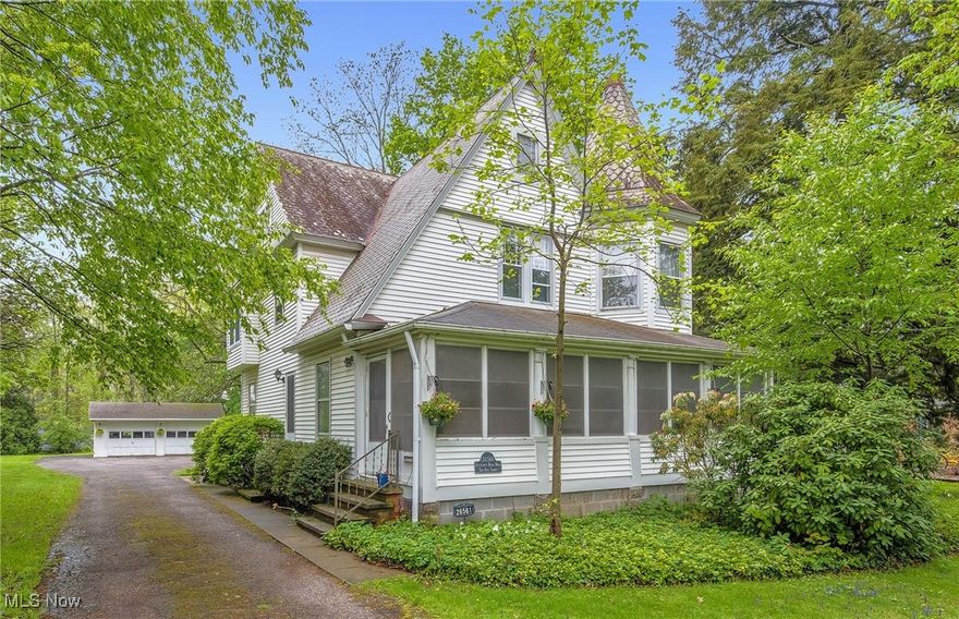 1890 Victorian Farmhouse on nearly 2 acres. Formerly known as the “Berryhill Farm,” its expansive lot is filled with wild raspberries by July 4th & blackberries by August. Walk in from its broad 27x8 screened porch to find exceptional ceiling heights & so much charm. The expansive 28x17 living room features a stone gas fireplace flanked y built-in cabinetry. The formal dining features built-ins & a window seat. A Pullman kitchen, huge pantry, powder room & enclosed back porch/mudroom (w/heated slate floor) complete the 1st level. Beyond the gracious room sizes are many modern updates including outstanding wiring throughout (all knob & tube replaced.) It has been wired for a projector w/retractable screen for family movie nights & surround sound, Nest learning thermostat & Sense (wi-fi enabled) electricity monitoring system. Up the wide spindled staircase are 4 bedrooms, an office (with shelving), a cedar closet & the full bath. Carpeted hardwood floors. Special lighting. The home’s turret houses the large master bedroom. The laundry is located in the full basement w/sump pump for your peace of mind. Copper & decorative wrought iron heat vents. Central air. All appliances remain. Well-maintained slate roof (inspected & repaired by a slate specialist.) All sewer lines have been replaced. The yard provides a large grassy area for baseball, volleyball, soccer, & more. Fire pit. Loaded with shade trees. A maze has been regularly mowed to the walking path along I-480. A John Deere X360  lawn mower will convey with the property to help you keep it looking beautiful. Just a bit of work and this slice of history can be magnificently yours.
