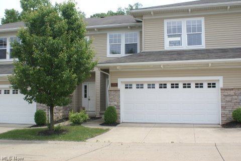 Like NEW! This 3 bedroom spacious townhouse, built in 2006, has all the conveniences. Easy access to highways, shopping and more! *private entrance *attached 2 car garage (w/hot and cold water) *first floor laundry *walk-in closet. This unit includes many upgrades throughout: *granite counters * upgraded cabinetry *stainless steel appliances *whirlpool tub* hardwood floors *neutral carpeting. The open floor plan is spacious, including breakfast bar, dining area and great room. A corner fireplace adds to the ambiance! Ample windows allow for natural light to come in. Step out onto the patio for wooded views and privacy. The full basement is ready for your own design. As you can see, too much to mention! Must call today for your private viewing!