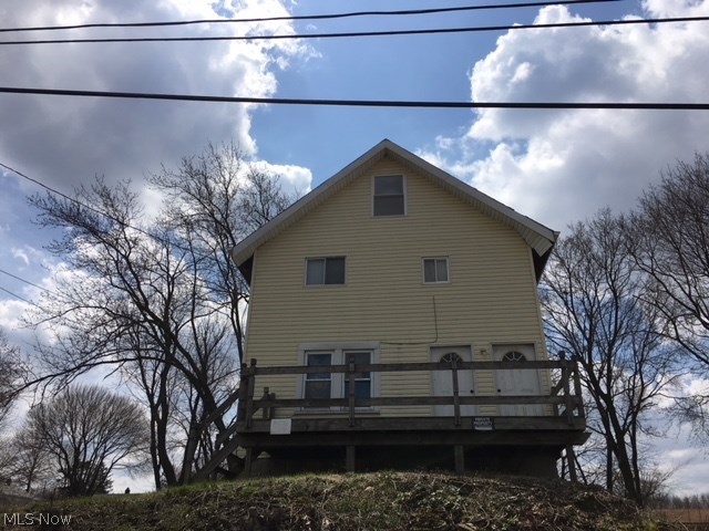 Great investment opportunity in a lovely Ellet neighborhood. This large home has a spacious kitchen with lots of oak cabinets and an laminate tops, as well as nice laminate floors. The additional room off the kitchen makes a great mudroom, office space or potential bathroom. There is also a living room and dining room on the main floor. The second level has 3 bedrooms and the full bathroom. Then on the third floor is an additional room. It does need some work, but is heated. The full, unfinished basement provides all the additional storage you would need. This home includes 5 lots total! Add a garage and turn this into a wonderful family home. Or build another home or duplex.
