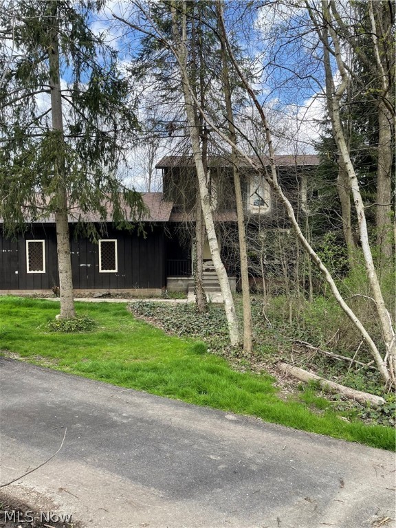 Discover the untapped potential in this genuine fixer-upper and prime investment opportunity on Ledge Road in Hinckley, OH. This property features 3 bedrooms and 2.5 baths. All of this is situated at the end of a winding driveway on a large, wooded, private 1.38-acre lot that includes a pond with a depth of 14 feet at its center. The house has great bones and offers amazing potential for a transformative renovation. Positioned in the highly rated and sought-after Highland Local School District, this residence presents an ideal chance to create a dream home in a desirable location. This is an all-electric home with a heat pump that is approximately 4-5 years old. Gas is available at the street. Buyers can explore cash purchases or renovation loans, opening doors for those ready to seize the potential and turn this property into a valuable investment. Don't miss out on the opportunity to unlock the possibilities of this Ledge Road home!