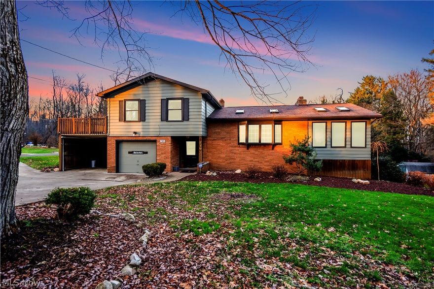 Welcome to 789 Wild Cherry Drive, a wonderful split-level home near Portage Lakes.  This home has 3 bedrooms and 2 full baths.  It includes an office space that could be used as a 4th bedroom.  This home features the perfect layout for entertaining as well as updates made to last.  Kitchen features new flooring, Hickory cabinets and Corian counter tops.  Large living room and formal dining features a floor to ceiling stone fireplace with a buck stove and wood burning insert, vaulted ceilings with Velux skylights.  Tons of natural lighting throughout this home!  Main level also features a bonus sun room with a gas fireplace for those cold Ohio nights, and Pella windows filling each wall and 4 Velux skylights, for those warm summer days.  Skylights feature rain sensors so you don't have to worry during spring showers.  Head upstairs to the 3rd level where you will find 3 bedrooms and access to a 30ft by 12 ft deck, perfect for entertaining.  3rd level also includes a Jack and Jill bathro