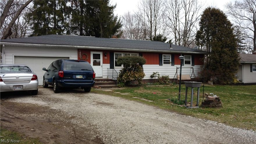 3 bedroom 1 bath Ranch home in  the heart of Portage Lakes on street that dead ends into the lake.  Full basement. 2 car attached Garage.