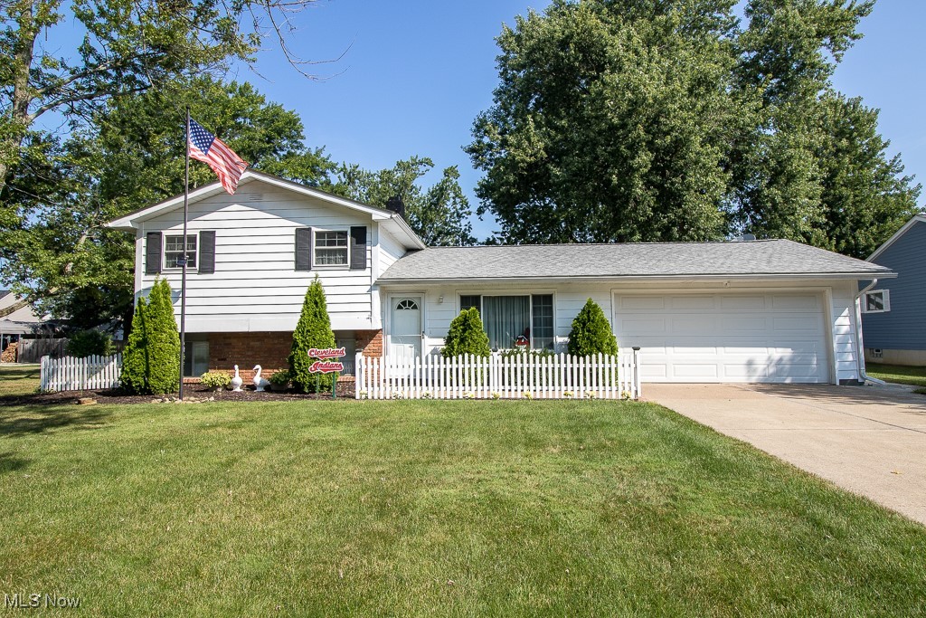 Welcome to this meticulously maintained Split Level with a beautiful fenced in backyard! As you enter the home you will walk into the living room looking through the centrally located kitchen into a specious area that can be used as a dining room or additional family room with sliding doors to a two season room. There is an office adjacent to the dining area space that has access to the backyard and entrance to the garage. The kitchen has a breakfast bar that looks down into the cozy family room with a gas fireplace, full bath, laundry room and bonus space that could serve as a craft area. All three bedrooms are found on the upper level of the home and feature gleaming hardwood floors, neutral décor, ample closet space and a full bath. The home sits on a lovely third of an acre with a beautiful landscaped backyard that includes a wood privacy fence and outbuilding. The back yard has plenty of room to expand the patio area for summer outdoor entertaining plus space for a garden, playground or even a pool. The home is situated on a quiet street. Roof 2020, Windows 2013, Furnace, 2024, AC 2021, Hot Water Heater 2021, Microwave 2025, Range 2003, Refrigerator 2013, Dishwasher 2015.