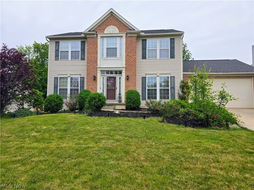 Welcome Home! Don't miss this spacious & beautifully decorated 4 Bedroom 4 Bath Colonial located in the Greentree Village of Streetsboro. Built in 2002 this home is great for a large family & perfect for entertaining for any occasion. The main floor features include a 2 story foyer which brings in lots of natural lighting & leads to the dining room, living room & family room with a center room fireplace surrounded by brick.  The large eat-in kitchen has updated countertops, backslash & includes some newer appliances & center island.  The sliding glass doors from the kitchen lead to a 2 story deck with a wooded rear view. Updated half bath also on main living area. The second floor has an open hallway with (3) spacious bedrooms & ample closets & full bath. Retreat to the large owners suite bedroom with a very large walk-in closet, private bathroom with double sinks. Additional living space is offered in the full finished walkout basement with sliding doors leading to a concreate patio, full bathroom & laundry area with plenty of storage also located in the basement. Additional updates include new roof 2019, flooring throughout,  front entry door lighting, freshly painted. This home offers everything you need in a great location in great condition! Don't miss the opportunity to call this home!