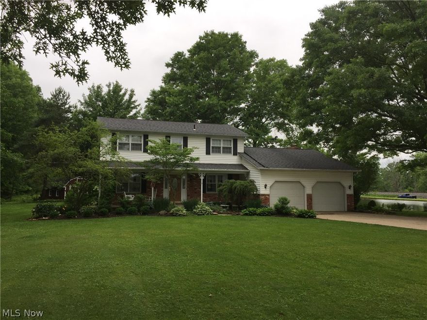 This beautiful well-maintained, immaculate, one-owner home sits on just over five partially-wooded acres in Valley City.  Gorgeous updated kitchen with white cabinets, granite counter-tops, stainless steel appliances, recessed lighting and hardwood floors. All appliances stay in this beautiful kitchen. Open concept floor plan from kitchen through family room boasts hard-wood floors and a wood-burning fireplace.  The large living room is perfect for entertaining.  The formal dining room also has hardwood floors and is perfect for holiday dinners. The half bath, laundry room and sun room complete the first floor.  Master bedroom and master bathroom along with three other large bedrooms and full bath ]are on the second floor.  Exterior features include beautifully landscaped yard with storage shed, attached 2-car garage, second over-sized 2-car garage and large pond. Generator to be included in the sale of the house.