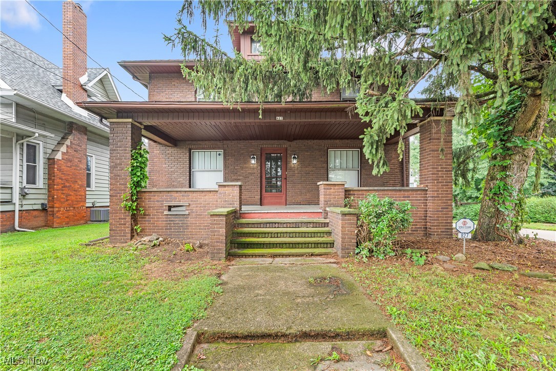 Love where you live! Welcome to your dream home! This beautifully maintained solid brick residence boasts a large front porch, perfect for sipping coffee or enjoying warm evenings. Step inside to discover original hardwood floors that add warmth and character throughout the living spaces. The inviting living room features elegant French doors that lead into a formal dining room, making it ideal for entertaining family and friends. Enjoy the cozy ambiance of the fireplace insert during chilly nights, while built-in shelves provide both functionality and style. Unwind in the luxurious bathroom, where you'll find a soothing whirlpool tub adorned with a charming tin ceiling. Additional highlights include a one-car garage for your convenience and a fenced-in backyard, perfect for pets and outdoor activities. Updates/ Upgrades include Leaf Filters 2021. Roof 2008/Central Air 2009/ Hot water tank 2008. Light fixtures throughout.