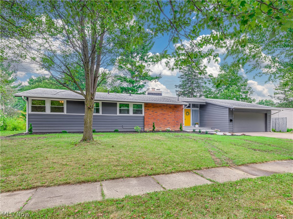 Wow! This home has amazing attention to detail and so many updates! As you enter the home you will notice the new cement entry way and patio area.
Love the yellow door! The outside of the home was painted including the soffits. There are new gutters and downspouts. Once inside the home you will appreciate the open feel and the flow of this home. High ceilings and a step-down family room add to the charm. There is new luxury vinyl flooring throughout this home, everything has been painted. The kitchen has been tastefully remodeled, and all the appliances are new. New carpet has been added to the bedrooms. The master bedroom has a full bath with a new walk-in shower. The main bath was totally remolded as well. New electrical box, New plumbing, New furnace and central Air, New windows, New glass block windows in basement, New light fixtures, New landscaping and much more. Everything in this newly updated home has been thought out and done with a sense of pride. You will not want to miss