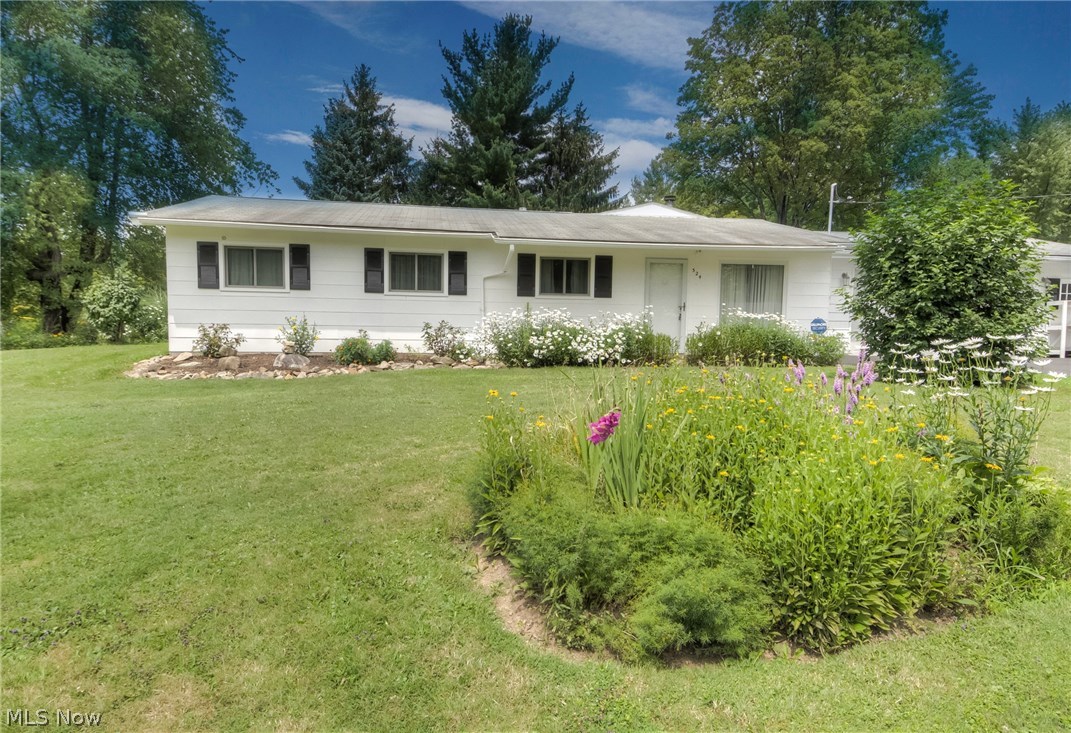 This four bedroom ranch located in Aurora offers one- floor living at an amazing price! All rooms have been recently painted to neutral colors and most flooring is newer throughout. Note the open floor plan with kitchen overlooking the family room. The family room a has custom-built wood burning fireplace and access to the park-like backyard amenities that include a deck with a retractable awning, separate gazebo, and separate fire pit area. The large laundry room has tons of built-in storage and a separate mud room comes in from the oversized 2-car garage with attached workshop. All kitchen appliances will remain for new owner. New windows were installed in 2009; central air installed in 2009; driveway resealed in 2016; hot water tank replaced in 2008; retractable awning 2011 and new garage door 2012. Home features 2.5 car garage. This home is move in ready and waiting for you! Make this your home today!