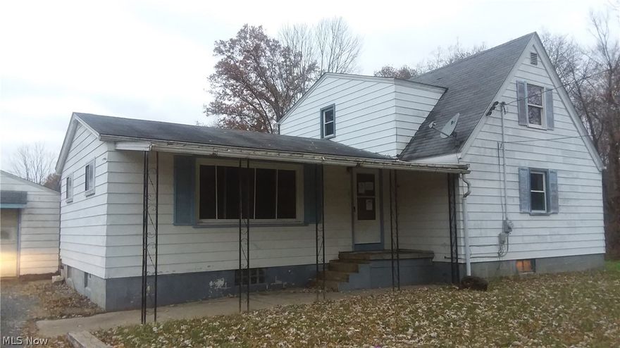 2.75 acre lot! Older barn and fenced in area at the back of the property. 2 car detached garage with a covered patio. Large eat in kitchen. Sold as is