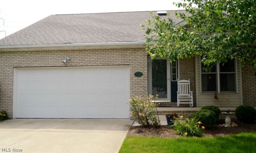 OPPORTUNITY KNOCKS! A well maintained two bedroom condominium located at the end of the road. The private location provides a beautiful view from the front porch of the wooded area. The first floor has attractive wood laminate flooring. The fully applianced kitchen has plenty of cabinets for storage space. There is a cathedral ceiling in the great room and a gas fireplace for that cozy atmosphere. The Master Bedroom has a large walk in closet for plenty of space. A convenient first floor laundry room with cabinets is available. The second level has a Bedroom, full bathroom, and a loft area for additional living space.  The full basement provides plenty of space for seasonal storage. There is a two car garage attached for easy access. Don't hesitate, call for an appointment to see !