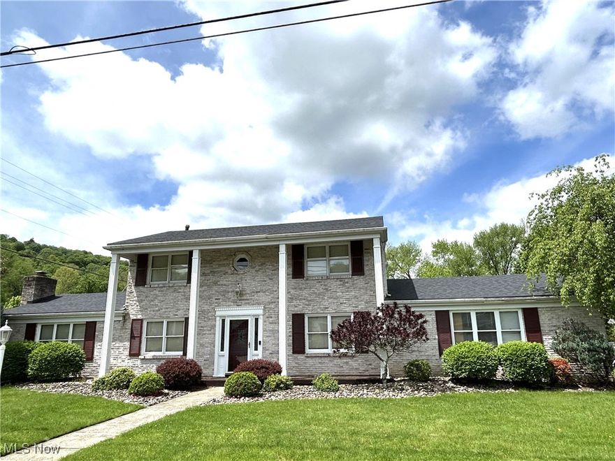 Welcome home to this charming 3-bedroom, 2.5 bath beauty in Country Club Estates! From the moment you step into the grand foyer, you'll be wowed by the elegant staircase and eye-catching chandelier. The main level offers everything you need for comfortable living and entertaining-granite countertops in the kitchen, a formal dining room with a large picture window, and a spacious family room with a gas fireplace. Need a bright space to relax? The sunroom, with its expansive windows and sliding glass doors leading to the back patio is the perfect spot. Enjoy the convenience of a first-floor laundry and guest friendly half bath. Upstairs, unwind in the large primary bedroom with its own full bath, along with two more comfortable bedrooms. The fenced-in back yard is flat and perfect for pets or summer BBQs. The 2 -car garage will keep you covered rain or shine. Homes like this don't come around often come see it before it's gone!