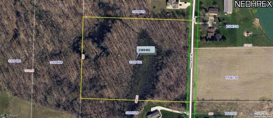 private 7.67 acre wooded lot perfect for walk-out Basement. 500' frontage. Wonderful location close to Rt. 62,  Dead-end street.  Park-like setting.