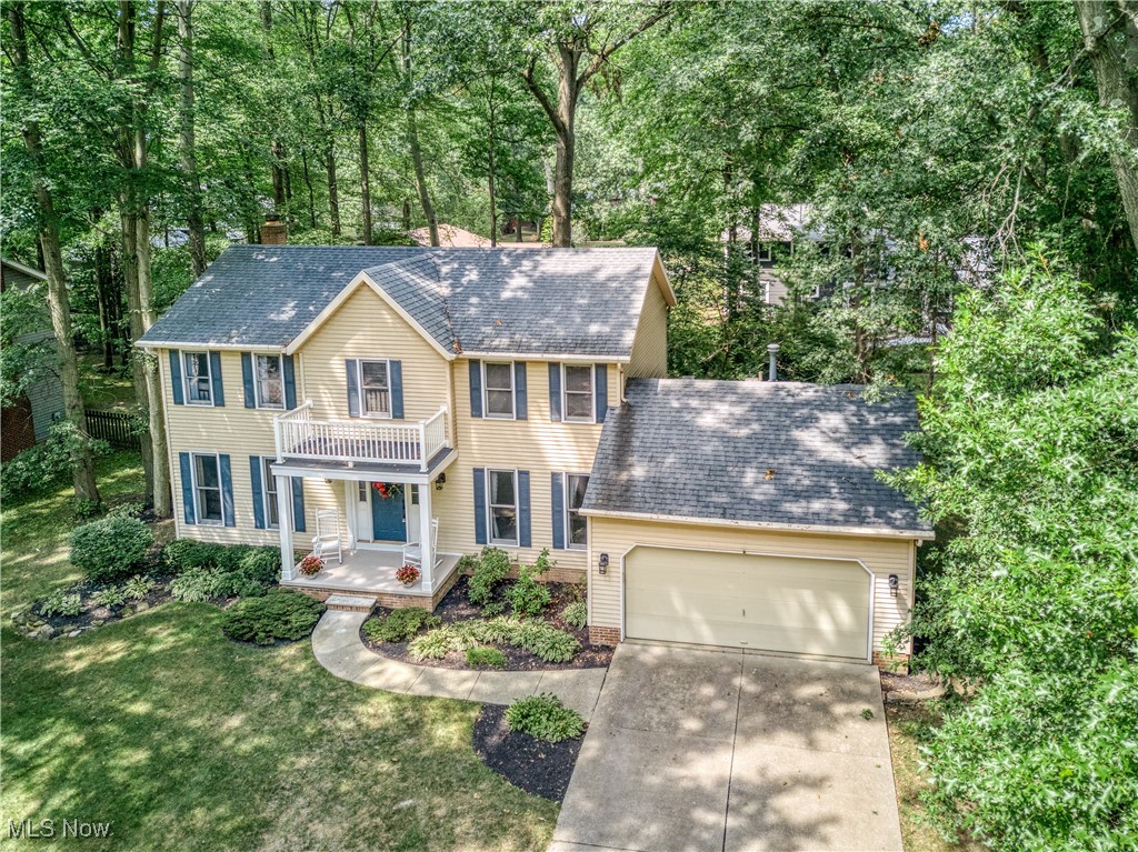 This beautifully maintained 4 Bedroom, 2.5 Bath Colonial is located in the sought-after Benwood Subdivision in Stow, Ohio! Situated on a quiet street & featuring a private, shady backyard, this home offers the perfect balance of classic charm, spacious living & a fantastic location - just minutes from schools, parks, restaurants and shopping! The inviting main level features a formal living room and a classic dining room with elegant crown molding and chair rail - ideal for hosting dinners and holidays! The large, bayed eat-in Kitchen includes all appliances, ceramic tile flooring, and a bright window overlooking the backyard! The eating area opens to a spacious deck through a sliding glass door - perfect for outdoor entertaining or just relaxing in the shade! The cozy family room offers a bayed window & a beautiful brick wood-burning fireplace. A convenient 1st floor laundry (washer & dryer included) and a powder room add to the home's everyday practicality. Upstairs, you will find 4 generous bedrooms, including a spacious master suite with walk-in closet & private bath featuring a soaking tub/shower combo, skylight, large vanity w/make-up area, double sinks & newer LVT flooring. The 3 additional bedrooms all have ample closet space and share the main bath. The finished lower level boasts a huge recreation room - pool table included! Ideal for a game room or home theater! There is also plenty of unfinished space for storage, hobbies or a workshop. Outside, you will enjoy the tree-lined yard (with a firepit) from the oversized deck! Attached 2 car garage offers convenience & extra storage. This well-maintained home is within walking distance to Oregon Trail Park and the popular KidStation Playground - perfect for families or outdoor enthusiasts! This is your opportunity to own an exceptional Colonial in one of Stow's most desirable neighborhoods! Auditor indicates 3 bedrooms but Seller states 4 bedrooms.