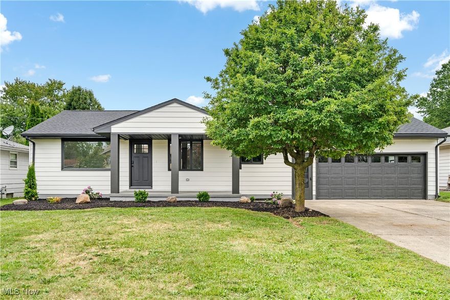 Welcome to this beautifully updated ranch-style home that perfectly blends modern finishes with comfortable living! You are greeted by a massive covered front porch for you to enjoy your morning coffee. The freshly done landscaping adds an even more homey feel. Step inside to an open and airy floor plan featuring a spacious living room filled with natural light from the large picture window. The seamless flow leads into the stunning kitchen, complete with crisp white cabinetry, sleek stainless steel appliances, subway tile backsplash, and plenty of counter space for cooking and entertaining. The dining area features a stylish light fixture separating the two spaces. The bathroom has been fully remodeled with a stylish double vanity, elegant lighting, and contemporary fixtures, giving it a spa-like feel. Three handsomely sized bedrooms completes the first floor. The basement offers a huge bonus living space that can be used as a family room, rec room, office or whatever you need. Additionally the basement features another fully renovated bathroom with a walk in shower, the laundry area and tons of storage space. The generous backyard provides the perfect place for your bonfires and outdoor entertaining. Fresh flooring, modern hardware, recessed lighting and thoughtful upgrades throughout make this home truly move-in ready. With its convenient single-level layout and tasteful renovations, this home offers comfort, function, and charm all in one. Perfect for anyone looking for easy living with a touch of sophistication! Call to schedule to your showing today!