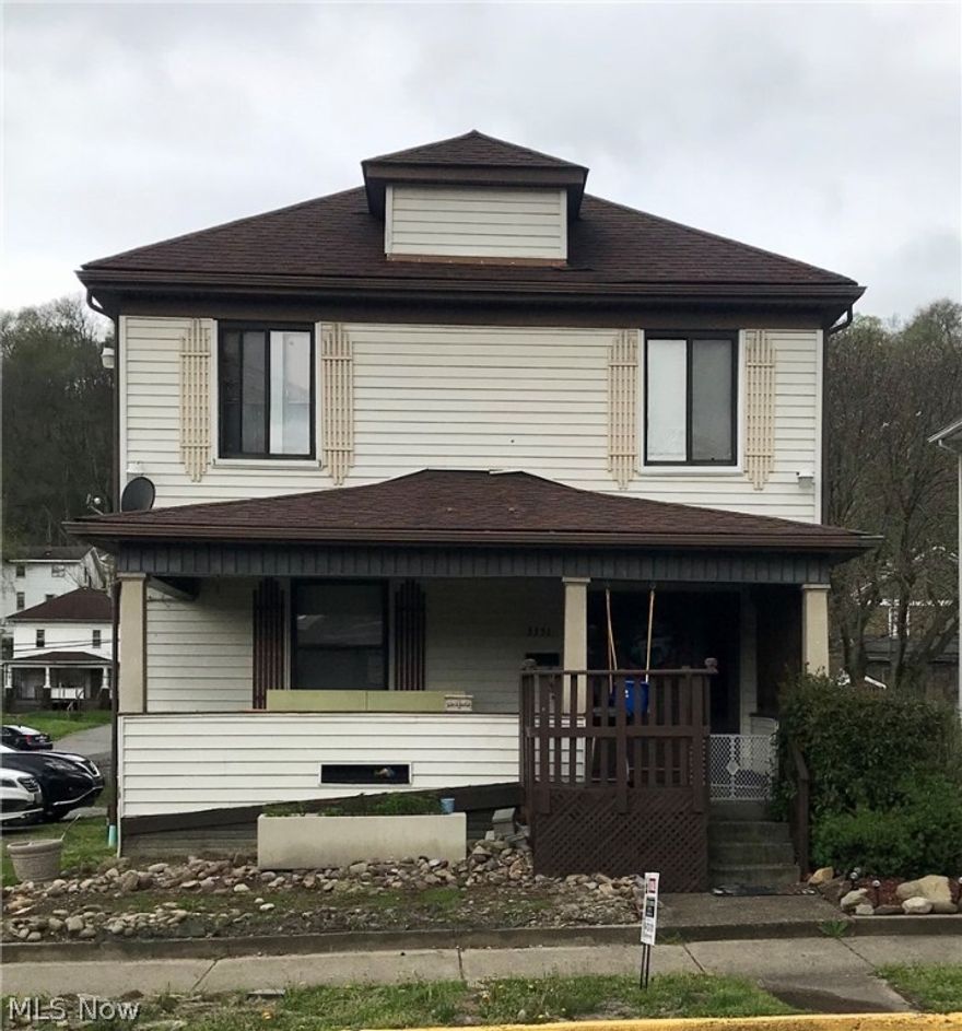 This property has had many recent updats--including newer foundation repairs, paint, lighting, flooring and more. The lovely home has a decorative fireplace in the living room and a dining room with built in bar. There's a newly refinished 1/2 bath on the first floor and all the rooms are large. This house has it's own 1 car garage and there's a separate 1 car garage apartment in back with 2 BRs, 1 BA. This property is situated right next to public parking. Currently both residences are rented and the seller states they bring in $12,000 annually.