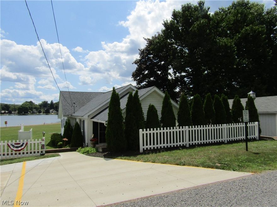 Fabulous fully furnished move-in ready beach house--the ONLY one available directly on the beautiful sandy Guilford Lake beach. FREE PONTOON BOAT on state maintained rental dock. Perfect for entertaining with back covered porch only sixty steps from sandy beach. Huge private patio with gas grill & gas fire-pit. Room for ten diners on covered front porch--have the whole family over to enjoy the lake & swimming. All furnishings, linens, appliances and furniture included and new since 2012. The current owner/agent (Ohio real estate license 2006007217) began operating it as a VRBO/AirBnB vacation rental in 2012 earning 100% 5 star reviews--it's that nice! The 2019 income from that operation was $14,905.00--rent it out a bit, make it your free vacation home! Although it's perfect for just a couple, it's large enough with three beds and two leather sofa-beds to host your entire family! Major additions and remodeling completed in 2010 or later included dramatic 440 square foot great room with
