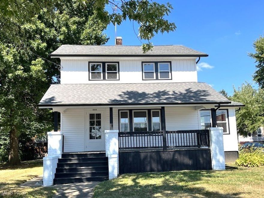 Step into this updated and remodeled 3-bedroom 1.5-bath Colonial in the heart of Barberton! New kitchen w white cabinetry and laminate floor which opens to the formal dining room. Cozy up in the living room to a stone fireplace flanked by bookcases. Lots of natural woodwork and hardwood floors throughout! Enjoy the convenience of the first-floor half bath addition. Sun room off the living room. Second floor offers 3 spacious bedrooms. Main bath boasts a huge walk-in shower with beautiful tile work and a separate tub. Relax on the front porch with new decking. Other updates: New windows & glass block, vinyl siding, furnace and central air, hot water tank 2024, freshly painted throughout. One-car detached garage w carport. Convenient location, close to hospital, restaurants and shopping.