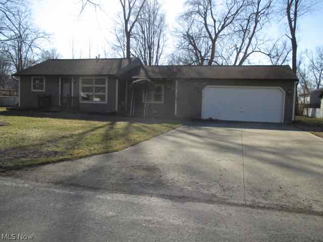 One floor living ... Ranch W/An Open, Floor plan Spacious Dining Area/24x24 Att. Gar. Treed Lot Beautifully Landscaped-shed, Patio, Deck/Concrete Drive/Walk To Lake & Beach