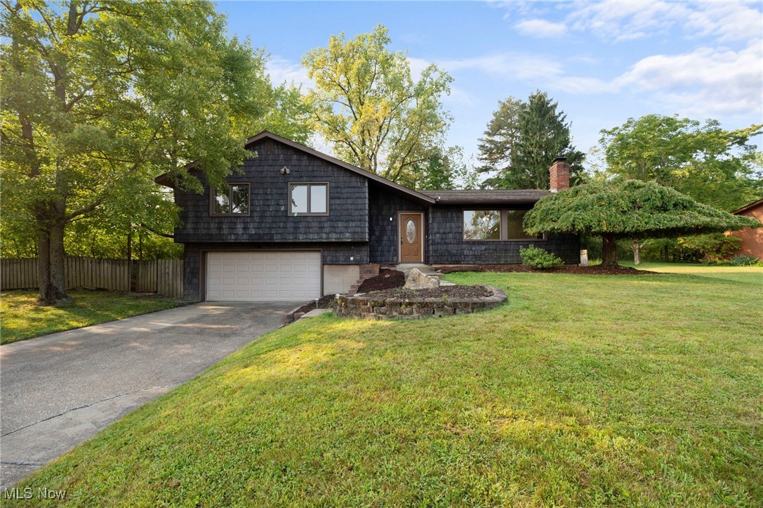 Come see this beautiful fully renovated house in one of the greatest neighborhoods in Strongsville. This 3 bed, 2 full baths home is a stunner and located just minutes from I-71. The entire interior of the house has been painted and renovated. The main living level is adorned with luxury vinyl plank flooring, while the upstairs has brand new carpet. The kitchen is equipped with brand new stainless steal appliances and granite countertops. Every light in the house is brand new, including adding overhead fan/lights in every bedroom. A large bathroom with a double vanity and tub/shower is at the beginning of the hallway, while the master bath has a brand new ceramic tile standup shower. Downstairs is a large laundry/mud room that leads out to the 2 car garage. The outside is very serene with trees surrounding the lot and a fenced in back yard. A new back patio and firepit is the perfect addition for entertaining. Don't wait to see this beauty as it is priced to sell and wont last long!!