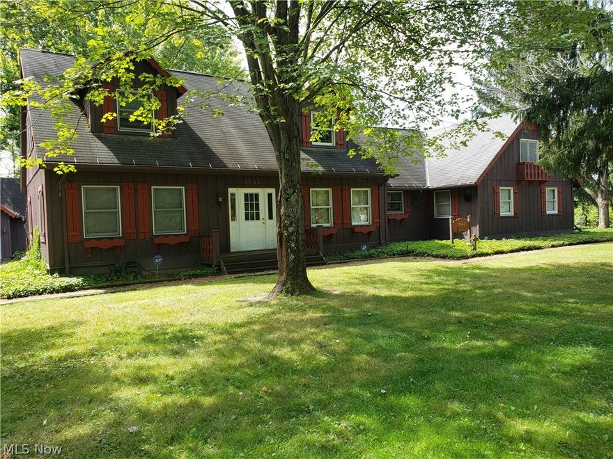 Are you looking for a home in Roaming Shores that has a private feel to it while being close to many amenities? Are you looking for a home with that true "lake house getaway feel"? Are you looking for a home large enough that the whole family can come to and enjoy all at the same time?   Welcome home!!!  1843 Morning Star has all of that and more.  Wrap around deck oriented to the west to capitalize on the views watching the boaters and skiers and spectacular sunsets. You get a front seat view of the amazing annual fireworks display from your deck. Your property adjoins the east side pool/beach area but is separated by a patch of woods. The cape cod home is Reminiscent of a Chalet with lots of gingerbread trim. The room in it just goes on and on. This is truly a home for those who love to entertain and have large gatherings!  It has Great Rm with a Franklin Stove, Vaulted Ceilings,  a Loft and Wet Bar. It adjoins a large enclosed 3 season room with windowed views of the lake. Central k