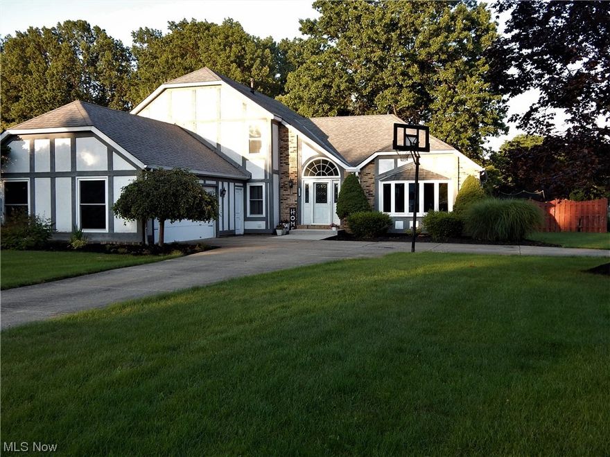 Attractive 4 Bedroom 3 full Bath Split Level on the outside that lives like a Colonial on the inside! Distinctive U-shaped Driveway + huge 600sf Garage has full attic. Gracious Curved Staircase impresses in the 2 story Foyer with Palladium Window & Etched Glass Door precedes the Vaulted Living /Dining Rooms that features a radiant Bay Window. (All New Windows in 2022) Updated Eat-in Kitchen has sleek Granite Counters, a host of Cabinets, LVT floors, Pantry & Skylight. Dishwasher, Microwave, Range & Refrigerator to stay! Only one step down into massive(24x15) Family Room with WBFP, a Pub Wet Bar Room & Private Wing that hosts a large Bedroom, Full Bath & Laundry so great for guests, In Laws, Office/Craft/Yoga Space etc. On the 2nd floor, you'll find the Vaulted, King-sized, Owner's Suite with Barn door entry to walk-in Closet & Redesigned ALL new Bath, that features a Spa-Caliber free standing soaking Tub, Granite Dual Sink Vanity& Double Sized Shower. 2 more well Closeted, nice sized B