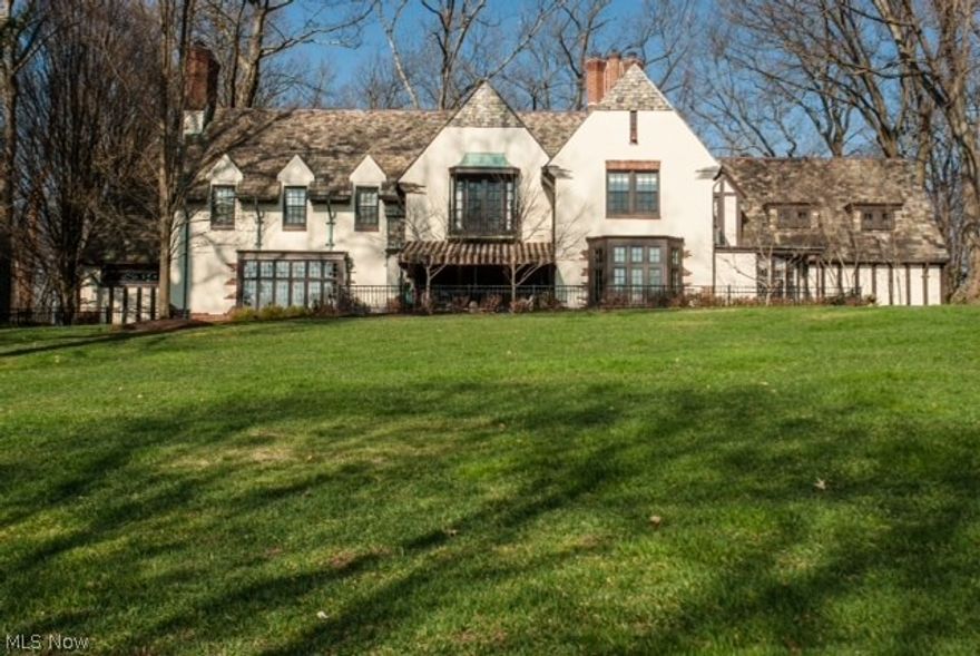 Old World charm and elegance at its finest. This classic Hills and Dales Village French Tudor offers architectural finery with modern day amenities. Centered around the grand Entrance Hall, this house was designed for entertaining. Flooring is composed of beautiful tile and hardwood and is complemented by the amazing plaster detailing throughout. The renovated Master Bath and Lower Level 2nd Kitchen will encourage you to have large and small gatherings alike. The Carriage House has been converted into a guest suite and exercise room for additional living space. This estate home affords comfort and grace and will impress even the most discriminating buyer.