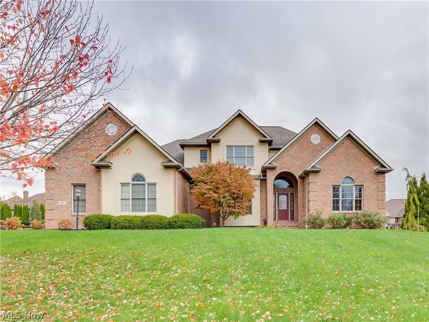 Classic charm abounds in this Saint James home. Approximately 5,000 square feet with finished lower level that includes a full bath, bedroom, awesome bar, sitting area with built-ins, large recreation area and ample storage. Walk in the front door and a two-story foyer greats you and the wall of windows in the  great room invites you in. First floor office with beautiful wood detail ceiling and built-ins. Expansive cherry kitchen with a 13x16 hearth room overlooking nice fenced backyard and stamped patio that has a nice fire circle.The double sided fireplace between the kitchen and the great room adds warmth and ambiance!  A sought after first floor master suite with jetted garden tub, double vanity and great walk-in closet tops things off. The second floor has three bedrooms and two full baths. A jack and Jill separates bedrooms two and three. Brick and stucco home with three car garage!