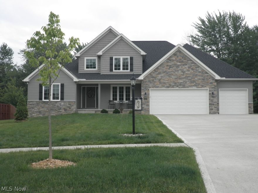 Exceptional quality Fireside Builders home nestled in a private wooded 17 lot newer subdivision. Value priced significantly lower than new construction on the street. This well appointed home features: granite kitchen counters, quality kitchen cabinets in espresso color, hardwood floors, two story family room. First floor owner's suite with outstanding spa featured bath. First floor den. Formal dining room with tray ceiling. Second floor offers two bedrooms plus loft/ bedroom and upgraded full bathroom. Classic exterior with brick and stone accents, front porch and expansive deck overlooking pretty backyard. Three car garage. Many upgrades have been put into this outstanding
home!