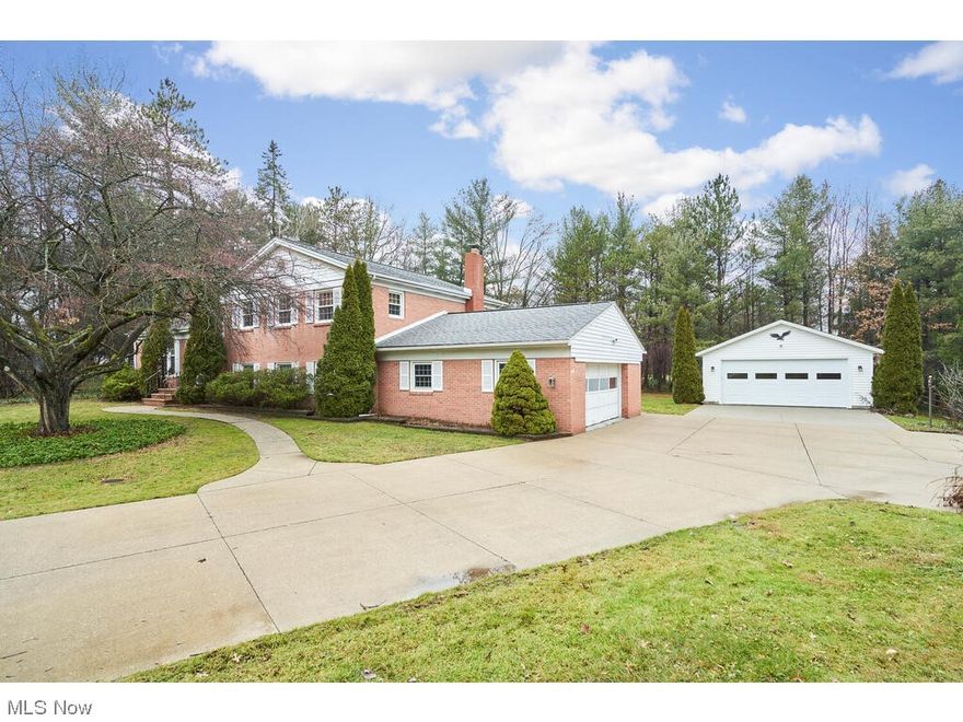 Lovely split level in Hudson Schools with over 2700 square feet of living space in Hudson's Greencrest neighborhood. The main level features living room with built-ins and a gas fireplace, formal dining room with eat-in kitchen with access to the screened porch. The upper level offers 4 bedrooms with 2 full baths. The finished lower level has a large family room/rec room with built in bar and 1/2 bath. Also on the lower level is the large utility/laundry room off of the attached 2-car garage. The home also has an unfinished basement. Outside there is an additional 28x24, 2-car detached garage and back patio.