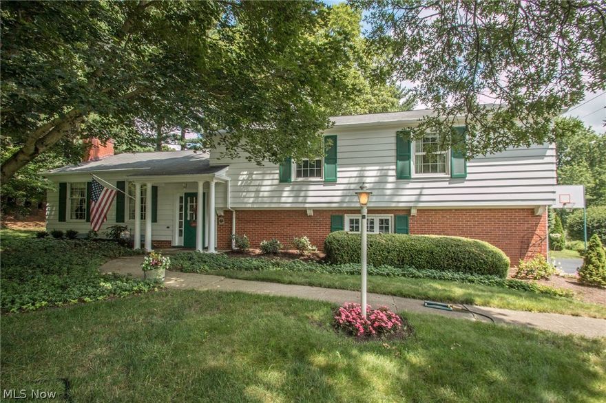 Tucked away in one of Kent's Hidden Gem neighborhoods, 5754 Caranor is very close to Kent State, Chase Park, bike n hike trails, shopping, KSU Wellness Center and Routes 59/261/43/76. This 4-level 4-bedroom/2.5 bath 2,450 sq. ft. 1962 split is not your average split level! The 6x11 slate foyer leads you to the main level living space. Bedrooms (all with hardwood) on second level. Laundry w/ utility shower and a half bath are in Lower Level with family room and mechanicals area one level below in basement, giving everyone a space! Very meticulously cared-for by the second owners for 33 years, you'll appreciate all the signs of clean and tidy. Beautiful yard w/ mature trees and landscaping & wonderful perennials and plantings for nature lovers. Enjoy the back yard swing, a gift from the sellers. Two fireplaces, one gas and one wood burning, are wonderful added heat sources. As well, mechanicals have been updated along the way (see mechanicals list from your Realtor). Roof (2008), Sunroom