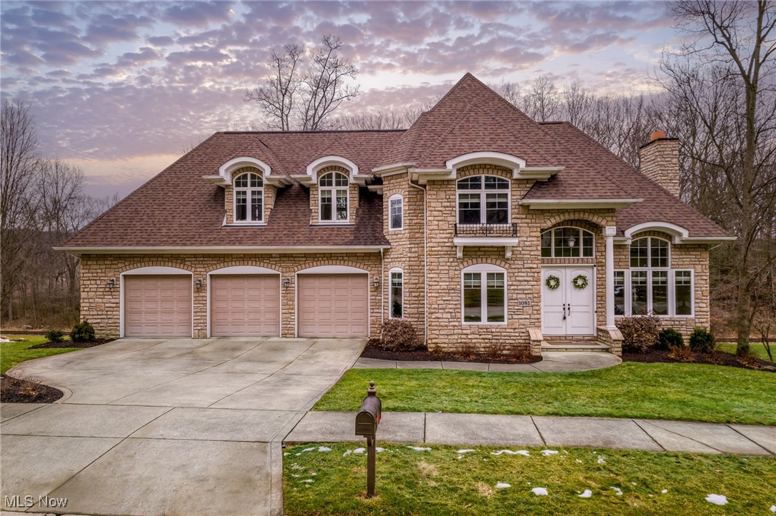 Welcome to this stunning residence located in Riverwoods, close to Stan Hywet Hall. This unique, custom-built home has had just one owner and is truly one of a kind. Throughout the home, you'll find solid birch wood floors along with some terracotta tile. The living room features a beamed ceiling and a formal marble gas fireplace, adding a touch of elegance.
Step into a chef's dream kitchen, equipped with every amenity needed to create culinary delights. It boasts stainless steel appliances, granite countertops, and ample cabinet space. There's a cozy spot for a round dining table in the eat-in kitchen, offering lovely views of the peaceful backyard.
The office is perfect for remote work, complete with built-in bookcases for storage. A laundry room is conveniently located on the first floor. Upstairs, you'll discover four bedrooms and two full bathrooms. The master suite is impressive, with spacious dimensions to accommodate any bedroom set and two built-in storage benches for extra blankets and pillows. The master bathroom features a relaxing soaking tub and a walk-in shower.
The lower level provides a fantastic space for enjoying wine, watching movies, or setting up a poker table, along with an additional full bathroom. Imagine celebrating the holidays while witnessing the Polar Express pass by! The Cuyahoga Scenic Railroad runs through the area several times a week for most months, allowing you to wave to passengers as they go by. With shops, restaurants, and more nearby, this home is ready for you—just pack your bags and move in! Roof was replaced in 2023, and the water heater in 2024.