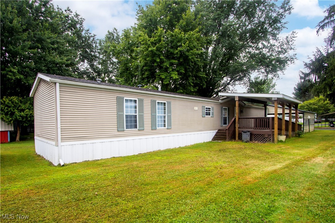 Welcome to 5852 Lot 44 Cleveland Road, Wooster – located in the quiet and well-kept Spruce Tree Mobile Home Park. This 1997 Spruce Ridge ES Kingsley model features 3 bedrooms and offers a clean, well-maintained interior surrounded by mature trees for added privacy and charm. Enjoy the convenience of a double-wide carport, a covered front porch, and a deck with an accessibility ramp. Inside, you’ll find a bright and inviting space with new appliances that will transfer to the new owner, making this home truly move-in ready. A storage shed in the backyard provides extra room for tools, equipment, or seasonal items. Whether you're looking for affordable living or a low-maintenance home in a great Wooster location, this is one you don’t want to miss!
