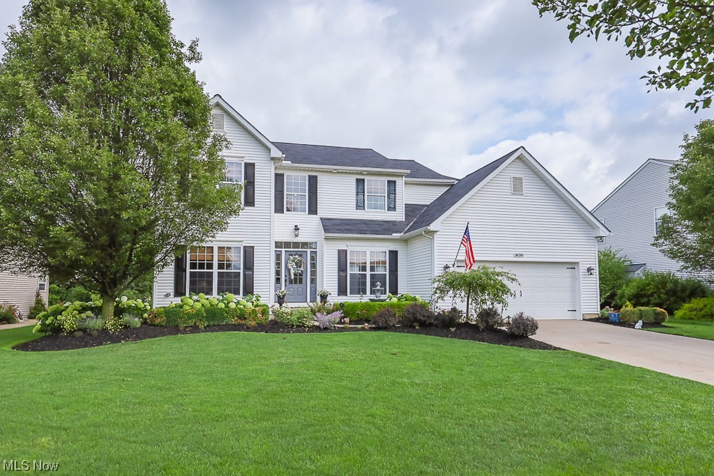 Beautiful Colonial Home in Avalon Estates! Grand entrance 2 story foyer with split staircase leading you into the kitchen. Featuring 4 beds, 2.5 baths, and over 3,400 sq ft of total living space. This gem boasts a spacious home office, large living room, and dining room all with gorgeous hardwood flooring and an updated ½ bath/powder room. Cozy up next to the wood burning fireplace with marble surround during those cold winter nights. The kitchen is the heart of the home featuring a stunning oversized island and breakfast bar w/granite countertops, additional storage, and bonus desk area all perfect for your holiday and entertaining needs. Morning room with an abundance of windows for natural light and sliders leading out to the two-level patio. Beautifully landscaped yard with lighting and a watering system added to flower beds for convenience. Basement area includes a playroom/craft room with French doors, a family room, a bar area, and additional unfinished storage space. Brand new