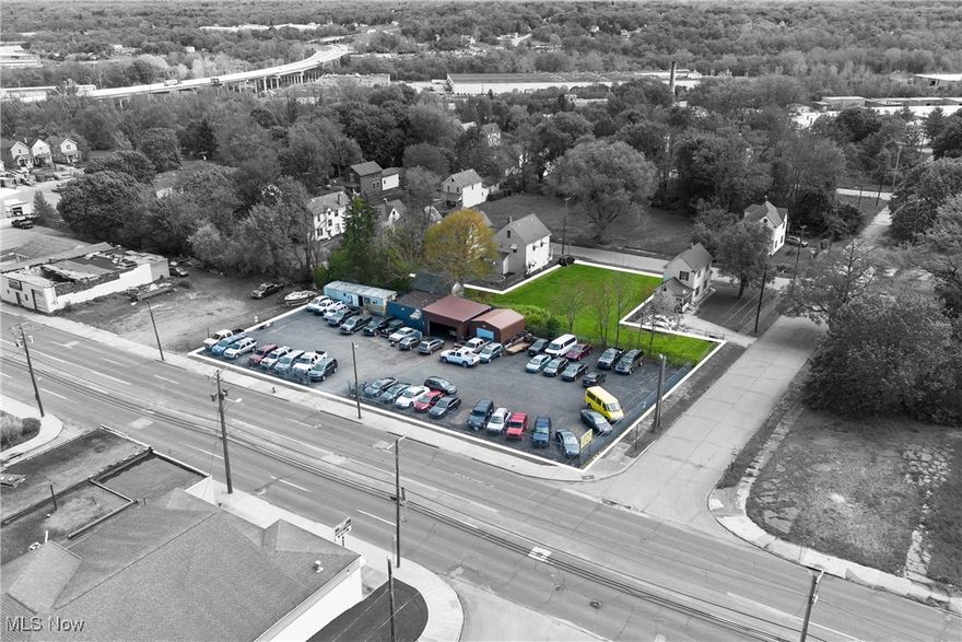 Prime Commercial Property Near Downtown Excellent business location just minutes from downtown! Situated on nearly 3/4 of an acre, this versatile property includes a trailer/office, brand-new garages with 9-car capacity, and a new vehicle lift — ideal for automotive, service, or storage operations. The lot has been newly blacktopped, providing ample space and a clean, professional appearance. Surveillance cameras and an electric barbed wire fence. Don't miss this opportunity to own a move-in-ready commercial site in a high-visibility area!