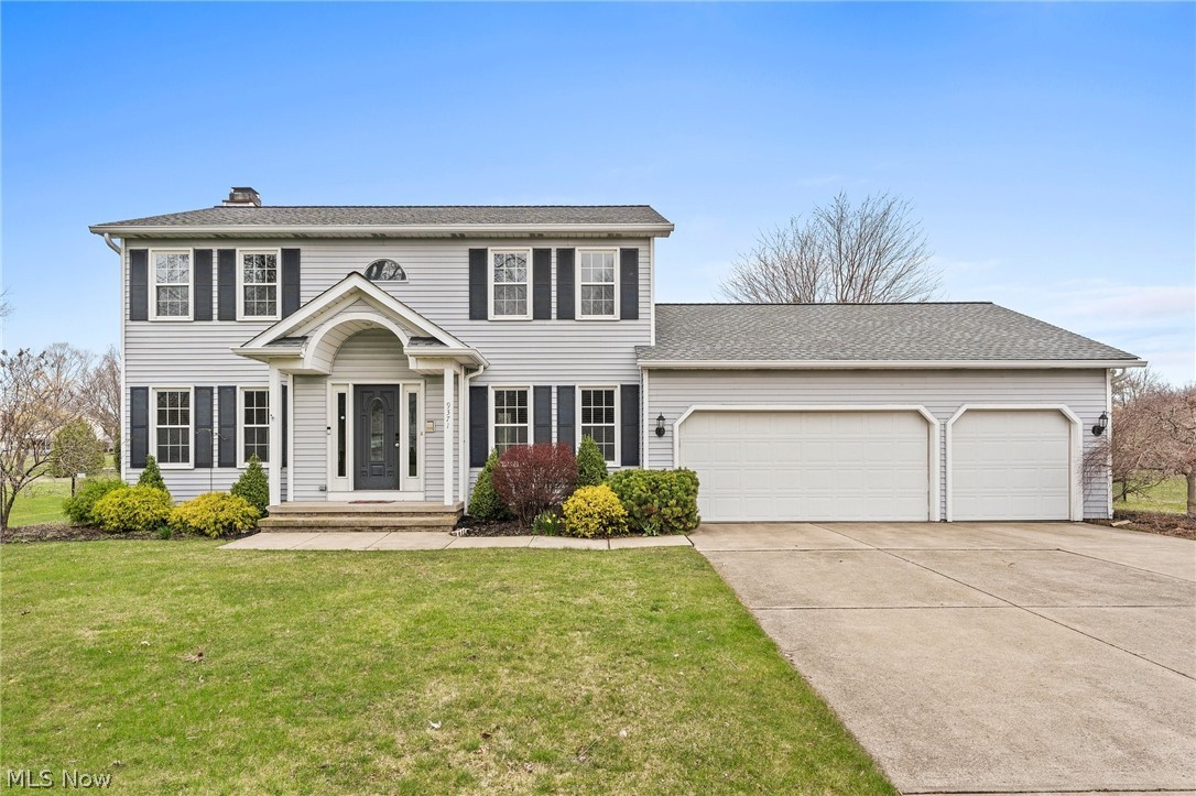 Nestled in the heart of Mentor, Ohio, this charming colonial offers a perfect blend of classic elegance and modern comfort. Boasting four bedrooms and three and a half baths, this is a spacious residence suitable for all! As you step through the front door, you are greeted by an inviting foyer and can see all the way to the back yard! To your right, the formal dining room provides ample space to eat, and to your left is the home office/den. The open living room with fireplace offers an ideal setting for watching TV, hanging out and entertaining on special occasions. The heart of the home is in the kitchen, which features ample cabinetry, granite countertops, and stainless steel appliances, not to mention the reach-in pantry and breakfast table area. Sliding doors lead to huge back yard that has patio, deck, pergola, fire ring and is entirely fenced. Convenient first floor laundry and half bath really make this special house a home! The luxurious primary suite is on the first floor, complete with a private en-suite bath featuring a soaking tub, separate shower, and dual vanity. Three additional upstairs bedrooms including an additional ensuite provide ample space for family and guests, while the additional two full baths ensure everyone's comfort and convenience. Outside, the meticulously landscaped yard offers plenty of room for outdoor recreation and relaxation. Whether you're hosting a summer cookout on the patio or enjoying a quiet evening under the stars, this backyard oasis is sure to impress.Conveniently located in Mentor, residents will enjoy easy access to shopping, dining, and entertainment. With its impeccable craftsmanship, desirable amenities, and prime location, this colonial home offers the perfect combination of style and sophistication for the discerning buyer. Don't miss your chance to make this dream home yours!