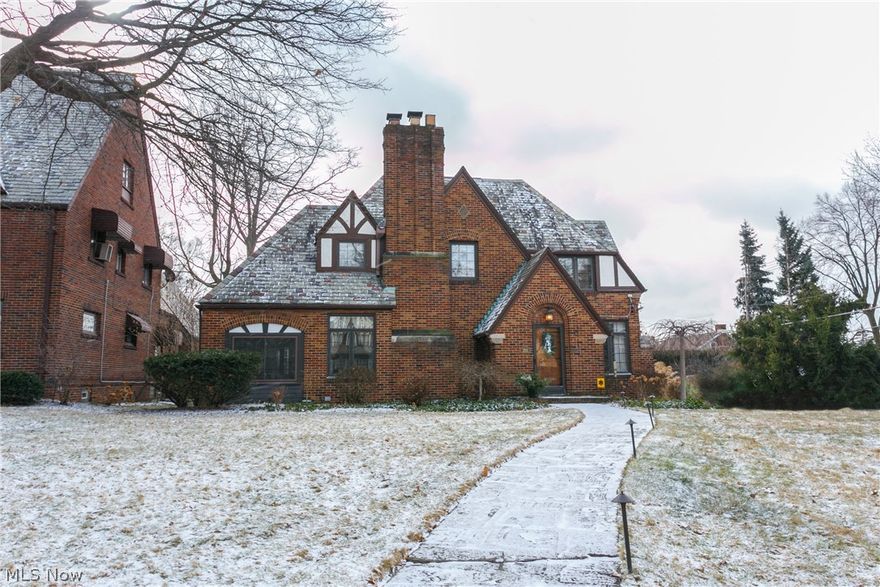 Be prepared to be amazed!  Fabulous tudor in beautiful historic Ridgewood!  Updated and trendy yet the original charm and character will amaze you.  3 bedrooms, 3 1/2 baths, beautiful great room with impressive fireplace, sun room, den and spectacular new kitchen with every space used - granite, stainless appliances, built-ins and just overall very cool!  Formal dining and separate dinette too.  You will fall in love with the beautiful hardwood floors, moldings built-ins and all the extras you would expect in this  fine home. For your convenience there is a 2nd floor laundry.  The master suite has a large walk-in closet, separate tiled shower, bubbling standing tub, double sinks/vanities - it's a definite WOW!  Finished basement area, 2 car garage, c/air, security.  Lovely patio area too.