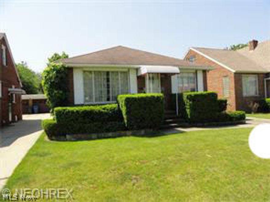 Solid Brick Ranch w/ brick sun room ,2 car detached garage. Large kitchen , dining room, nice sized bedrooms, finished basement/ nice size rec room.  Some appliances stay. Loads of storage. Close to freeway , bus  & shopping.