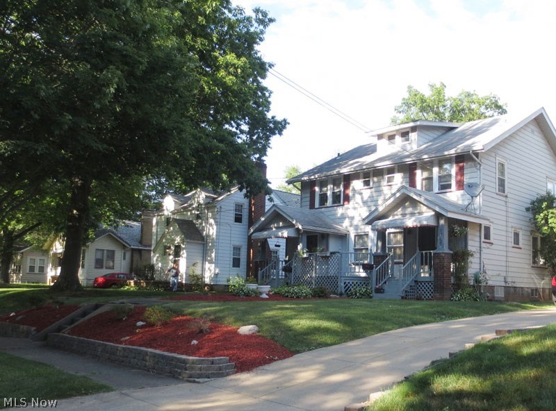 Unique side by side duplex is in wonderful condition and is partly owner occupied and tenant has a 1 yr lease. Newer furnaces. Basement has been waterproofed on 1761 side and the windows have been replaced on owners unit. There is a huge carport and units share an enclosed porch area that is charming. Inside this well kept property are beautiful hardwood floors, formal dining rooms. Units are identical. This is an awesome neighborhood and this would be great for an "owner occupant."