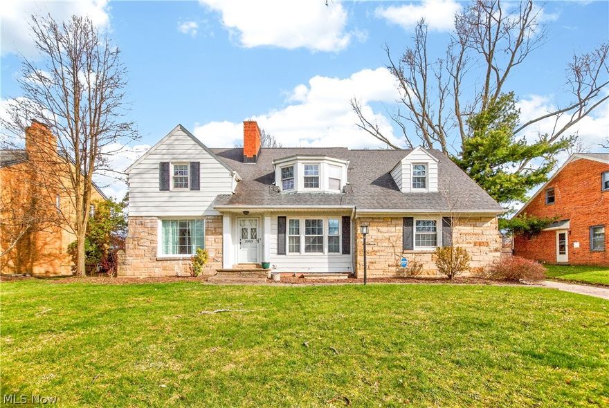 This classic 3-bedroom, 1.5-bath Shaker Colonial perfectly blends timeless character with modern efficiency. The main level features an open, flowing floor plan with Brand New refinished hardwood floors (2026) upper and lower levels, a formal living room with a fireplace, and a formal dining room. A dedicated first-floor den/office with built-ins offers flexible use as a possible fourth bedroom. The updated kitchen provides excellent storage and direct access to a private screened porch. Upstairs, find generously sized bedrooms and a stylishly renovated full bathroom (2021). The finished lower-level recreation room adds versatile living space. Significant mechanical and exterior updates—including a 2-stage variable-speed furnace, gutter rails (2023), sidewalk repairs (2024), and fresh interior paint (2025)—ensure peace of mind. The property includes a 2-car attached rear-entry garage and a large fenced backyard. Located in a highly walkable, community-oriented neighborhood, this home is moments from John Carroll University, local amenities, and Shaker Schools. Seller paid America's Preferred Home Warrenty Included.