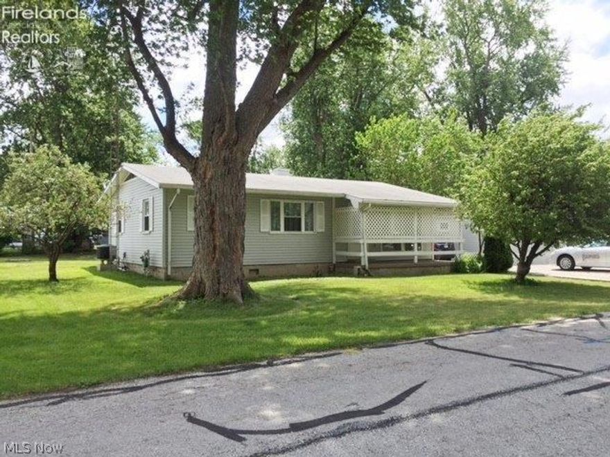 LAKE ERIE VIEWS AND access rights from this 3 bedroom, 1.5 bath open floor plan 1 story home which includes a charming old fishing cottage (with electric) on the property - make it a guest cottage, fun playhouse or crafting spot. Shed also on property. Many upgrades include; New water heater, New cook top, sink & counter tops, new moisture resistant laminate floors and carpet, remodeled bathrooms, 4 vinyl windows, newer furnace and Central A/C (if needed, as you will enjoy summer breezes off the lake). Property surrounded by your own fruit trees. Dockage is available at nearby marinas if desired, also a short 5 minute drive to the Jet express for Island Hopping. (room sizes approxmate, 3 season room not included in total square footage)