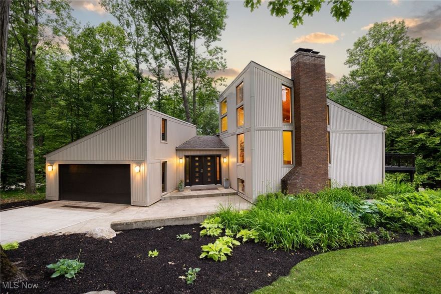 Welcome to this beautifully updated home on Oak Ridge Drive, where modern upgrades and thoughtful renovations shine throughout. Nearly every aspect of this property has been improved over the past decade, offering both style and peace of mind. The kitchen was fully remodeled in 2017 and features high-end Monogram stainless steel appliances, sleek cabinetry, and contemporary finishes. All new windows and flooring were completed in 2016, providing a fresh and energy-efficient foundation. In 2025, all bathrooms were remodeled, and new carpet was added, complementing the 2023 updates which included additional carpet installation, a brand-new AC unit, and a full Trex deck. The furnace was moved to the attic in 2023 for better efficiency and space optimization. Outdoor upgrades include a new concrete driveway, retaining wall, and patio—all completed in 2023—as well as updated landscaping in 2021 and a new roof in 2020. The lower-level conversation pit was completed in 2019 and is perfect for relaxing or entertaining, alongside a custom wet bar added in 2018. Heated gutters with a transferable lifetime warranty and free annual cleaning round out this home's extensive list of updates. Every improvement has been made with care and quality, making this home completely move-in ready.