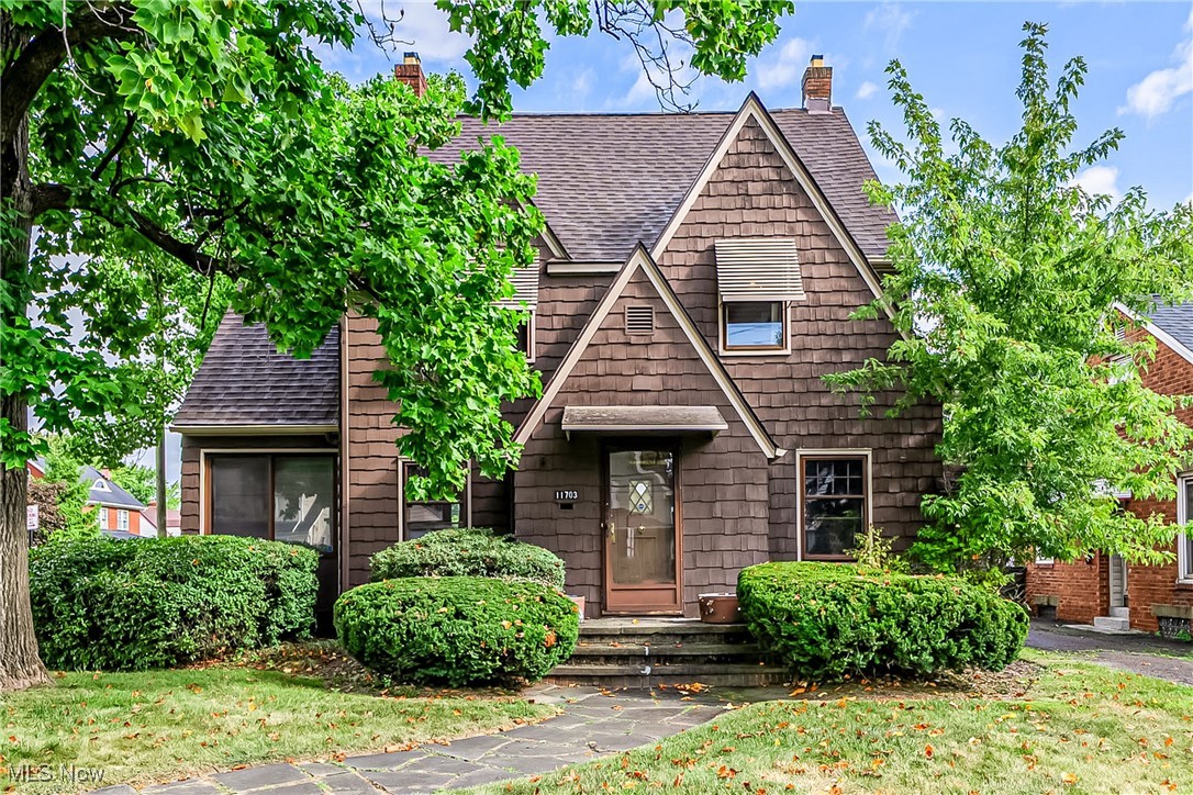 Charming 1929 Colonial in Garfield Heights! This 3-bedroom, 1.5-bath home is filled with character and comfort. Step inside to a welcoming living room with a cozy fireplace, perfect for relaxing evenings. A bright sunroom adds extra living space to enjoy year-round. The kitchen comes with all appliances included, making move-in a breeze. Upstairs, you’ll find three comfortable bedrooms with plenty of natural light. Additional highlights include a full basement, walk-up attic, detached garage, and storage shed. With carpeted living spaces, classic details, and a convenient location in the Garfield Heights area, this home is ready for you to make it your own!