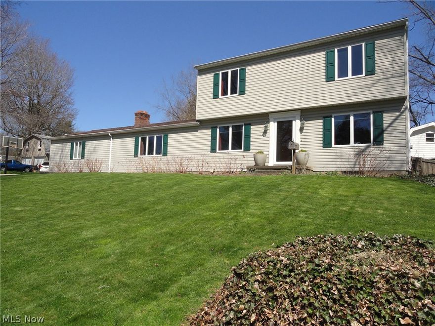 Sharp Colonial in desirable Stow location close to Wetmore Park and Holy Family Church.  Very well maintained with many recent updates plus unique and trendy decor throughout! Great floor plan with huge family room addition that includes beautiful built in bookshelves, full brick wall fireplace, and sliders to a fabulous private patio area with a 12 x 12 raised deck porch & gazebo. Fantastic eat in kitchen with modern style cabinets, concrete counters, stainless appliances, and tiled back splash. Living room plus office or den and 1/2 bath complete the first floor. Three bedrooms and two full baths upstairs. All bathrooms nicely updated too! Hardwood floors under carpet throughout. Full basement. Concrete driveway with extra parking and room for basketball. Updates include furnace, AC, water heater, Anderson windows, roof, and siding! Home warranty included.