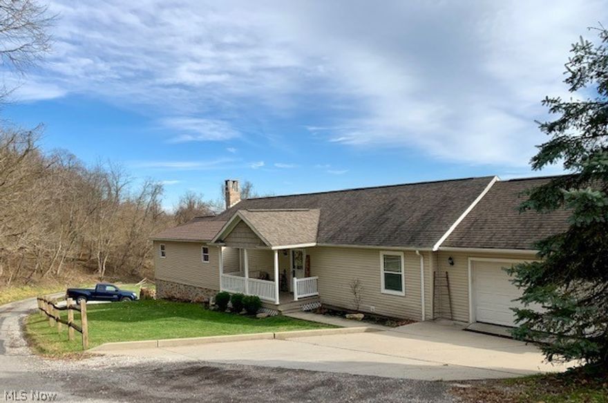 Beautiful, updated home in one of Martins Ferry's favorite neighborhoods- the desirable Crawford Heights! The owners have been busy improving the current outdoor space by adding retaining walls and landscaping, purchasing the neighboring lot to add yard space & additional parking and building an additional 42X24 wrap around deck to total 1200 sq. ft. of finished outdoor living area. In 2016 the owners built an addition adding a 3rd bedroom on the first floor and basement storage. The main floor of this ranch style home has everything you need, including a view of the city and Ohio River Valley from many windows and back deck. Spacious foyer/mudroom for welcoming guests, 3 bedrooms, 2 full baths, laundry room and open concept living, dining room and kitchen area. New laminate wood flooring throughout much of the main level. The fully equipped kitchen is open and airy and includes a "home school" nook that can't be beat! If you love to entertain or just need guest space, you will love the finished basement that is complete with a full bath, laundry hook-ups, weight room, living room, kitchen and fourth bedroom. Basement has French doors that walk out to additional parking area, so this space could be the perfect in-law suite or help pay your mortgage as potential rental income. Woodchuck wood burner stays, new chimney flue with lifetime warranty installed in 2020.