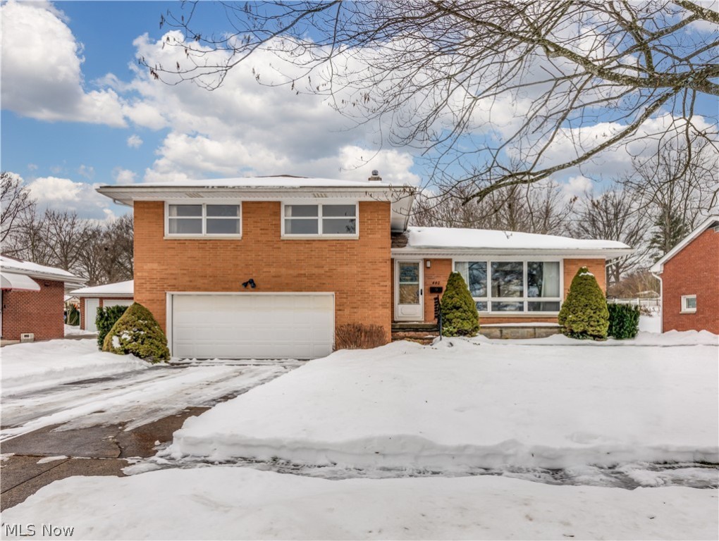 Welcome to 440 Orrville Ave, a well built brick four level split level. It's obvious that this home has been well maintained for many years, currently it has newer HVAC and water heater. Even though the kitchen and bathrooms are original, they are in excellent condition and the vintage style is charming. There are hardwood floors under the carpet in most of the rooms and they appear to be in very good condition. The spacious L shaped living and dining room have large picture windows flooding the area with natural light. The lower level family room steps out into a 21 x 13 glass enclosed room with cathedral ceiling overlooking the large fenced backyard and nice patio area. The basement has a large laundry/storage area plus a rec room that is paneled and carpeted. The three spacious bedrooms are bright and open with large closets, the master bedroom has a 1/2 bath and the family room has a 1/2 bath . The attached two car garage is oversized with extra storage too. All of these fe