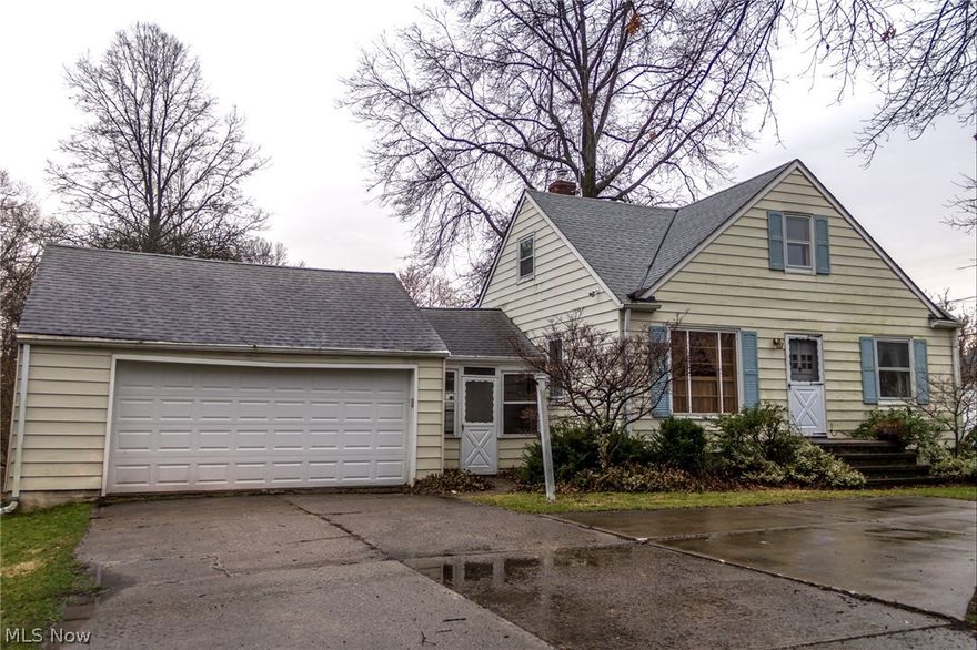 Large Cape Cod on 1.16 acres with creek.  5 Bedrooms. 1.5 Baths. Finished Rec Room. Over sized/extended Kitchen. Breezeway between house and 2 Car Garage. Lots of storage everywhere. Some newer windows. Glassblock windows. Whole house generator. One year Home Warranty with Buyer Upgrade. Come and see your new home today! Being sold as-is