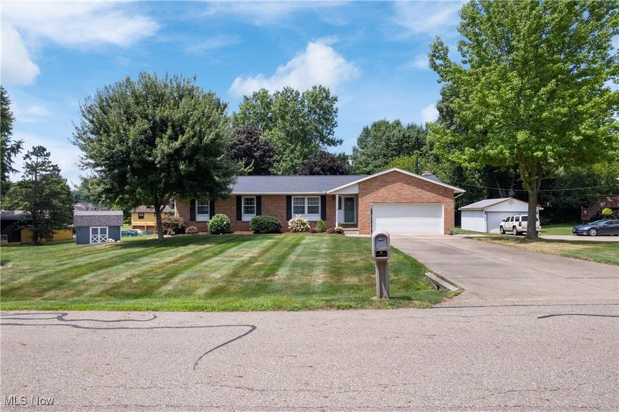 Immaculate 3 bedroom 3 bath ranch home in desirable Green school district. This house has been very well maintained and offers so many living options! Traditional ranch floor plan with living room, dining room and kitchen as you enter and 3 bedrooms and bath off a main hall. The primary bedroom also has its own full bathroom. Off the kitchen is a family room with fireplace which opens to a spacious deck overlooking a serene backyard. The walk out basement has endless possibilities. It has been partly finished including a full bathroom with walk-in shower. There is a side for utilities and laundry, a large finished room currently used as a sewing studio, and another workshop room with a door to the outside. Updates include: Roof 2024; Flooring on main level less than 4 years old. Less than 6 years old: furnace, central air unit, hot water tank, pressure tank for well, and sump pump. Barn is less than 10 years old. Living here allows easy drives to both Akron and Canton. Seller will miss the yard and the neighbors. So many possibilities in this beautiful home! Schedule your tour now!