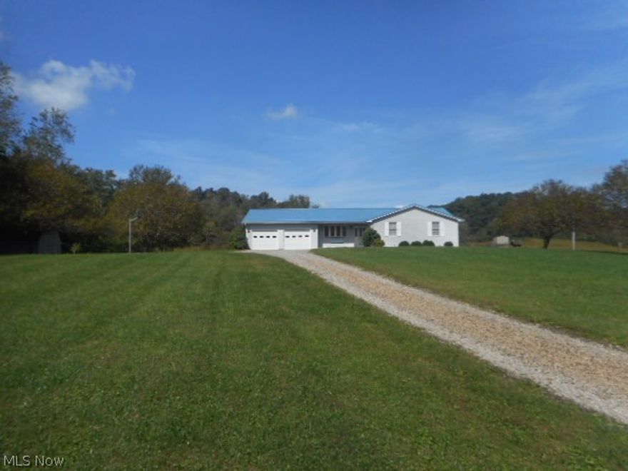 This beautiful ranch home is just minutes from downtown Marietta-but so peaceful it feels like a vacation home! Relax on the back deck, with gorgeous views of the hills behind. Lounge in the pool on a hot summer day. Go fishing, kayaking, or canoeing from the Little Muskingum River-  the property includes 258 feet of frontage, with fiberglass steps leading to a dock. This home is perfect if you are seeking peace, quiet, and beautiful view.
This home has been well-maintained over the last 8 years, with recent updates including new roofing, A/C, furnace, pool liner, and pool cover. The kitchen , dining room, and living room are cozy and warm, and all have views of either hills or the river. The bedrooms and office are all on the same floor, with no need to climb stairs to get from one room to another. A large, unfinished basement offers plenty of storage space-or the opportunity to double your living space. The garage and outdoor shed offer plenty of space for storage or setting up a workbench. The 4-acre yard is peaceful, quiet and HUGE...Enjoy the deck and the spacious backyard. Perfect for gatherings!