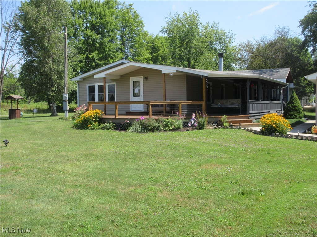 Beautiful ranch on a spacious 0.918-acre lot. This 3-bedroom, 2-bathroom ranch-style home offers the perfect blend of comfort and convenience. Enjoy the deck to take in the peaceful surroundings. The property features a detached garage, two boat houses, and a storage shed-ideal for outdoor enthusiasts and lake lovers. Boat dock included. Seller will assist buyer in transferring dock. Boat House 26 x 38 10' ceiling. Storage shed 10 x 12. This home is a rare find for those seeking tranquility and functionality in one beautiful package. Short distance to Pymatuning lake.